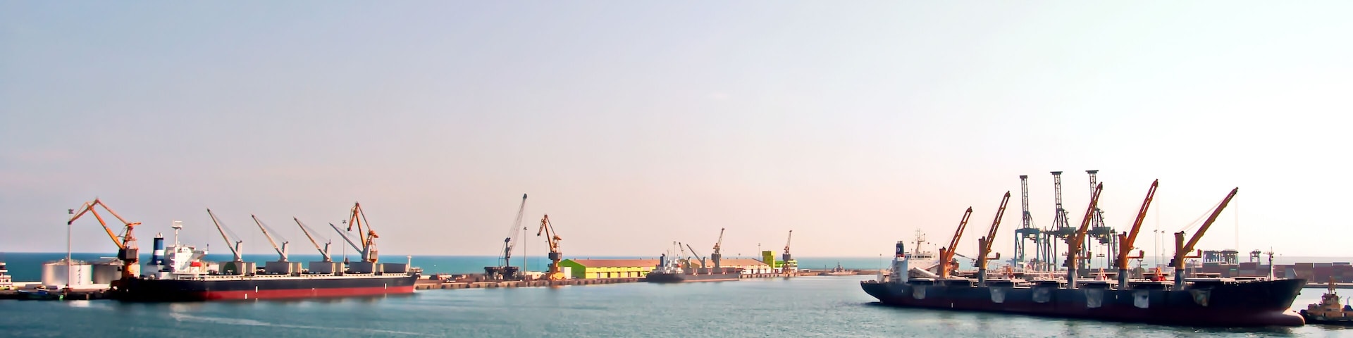 Seascape and landscape of the coastline and waters of the port of Tuticorin, India.Panoramic views of the coastline,fishing boats and ships in the port.; Shutterstock ID 1202713258; Purchase Order: SP