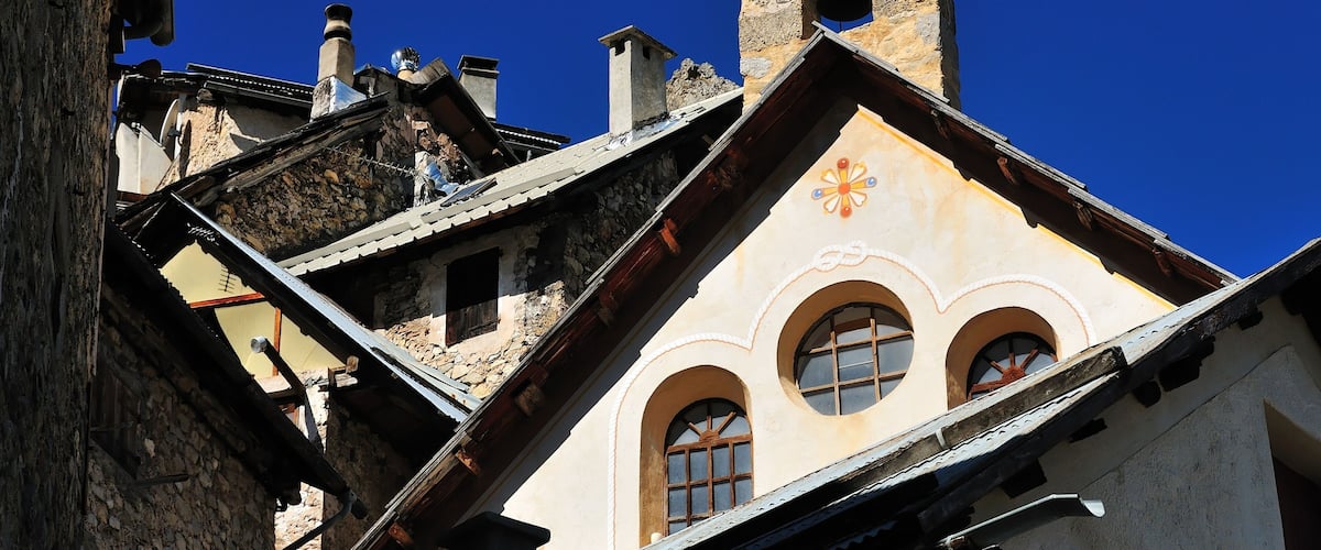 A church with a bell tower and arched windows.