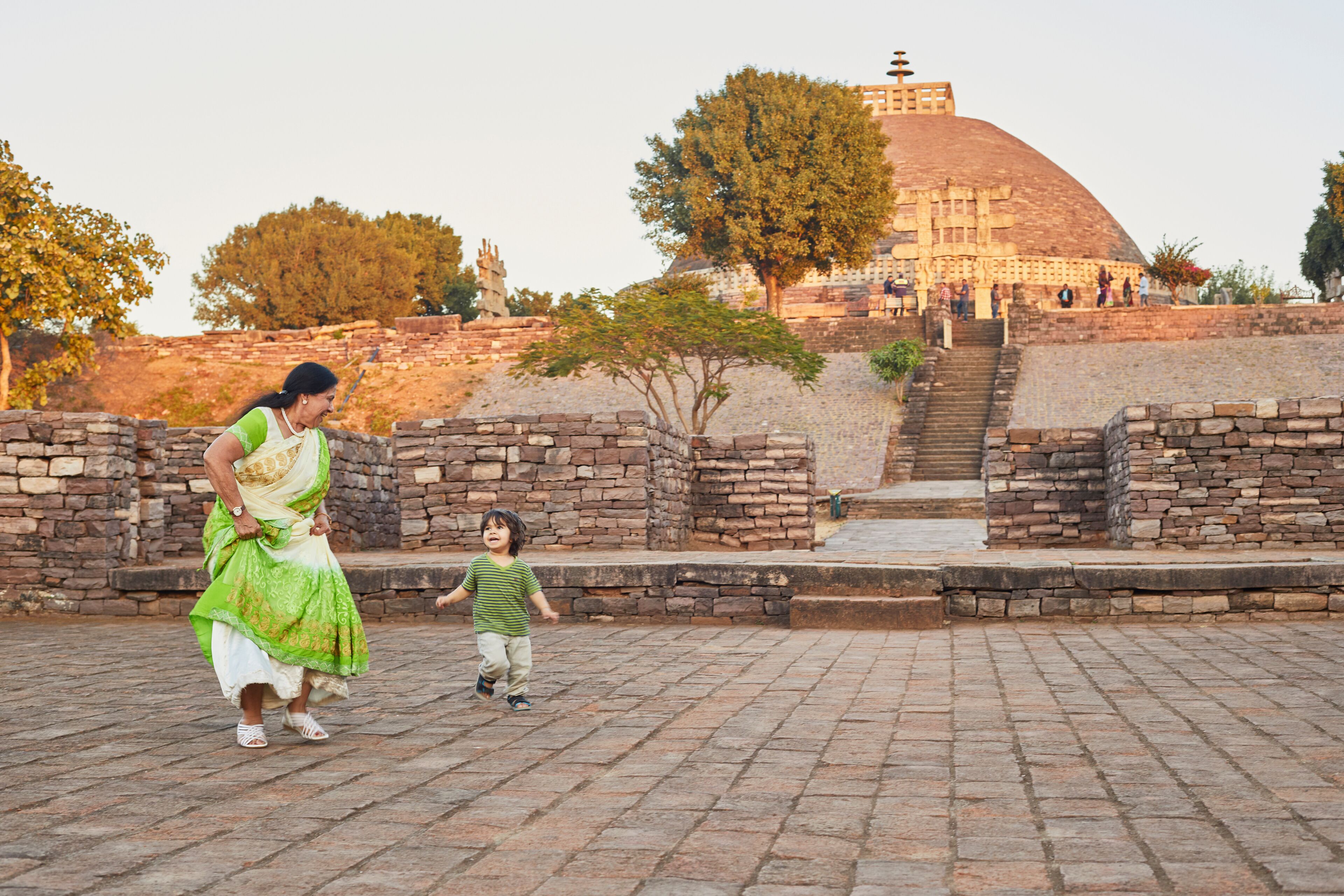 Grandmother playing with grandson at square, Bhopal, Madhya Pradesh, India