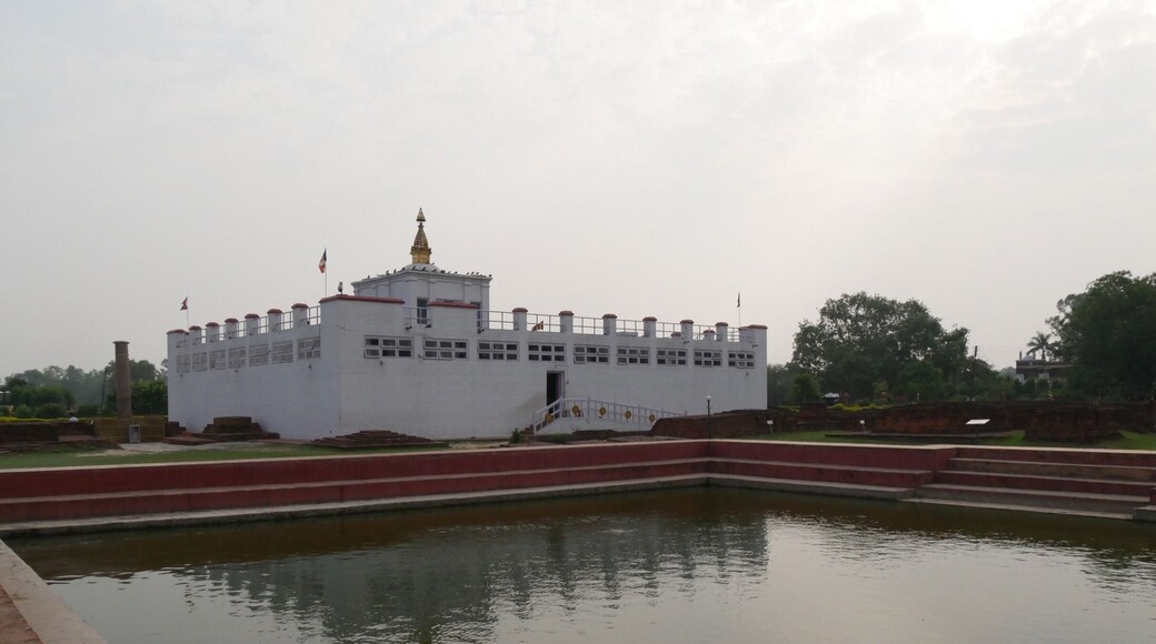 The Maya Devi temple sits over the spot where the Buddha (Prince Siddhartha) was born. Inside you can see the marker stone that pinpoints the spot where the Buddha was born as well as a sandstone carving of the birth of the Buddha from the 14th century. (No photos inside) The sacred pond in front is where Queen Maya Devi was said to have bathed before giving birth to the Buddha. Lumbini, Nepal.
