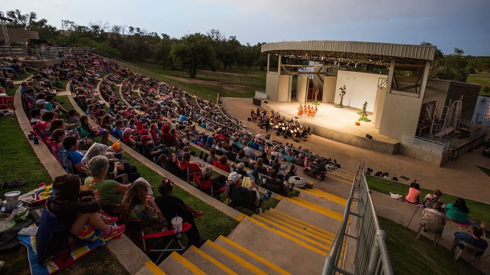 Lubbock featuring performance art and theatre scenes as well as a large group of people