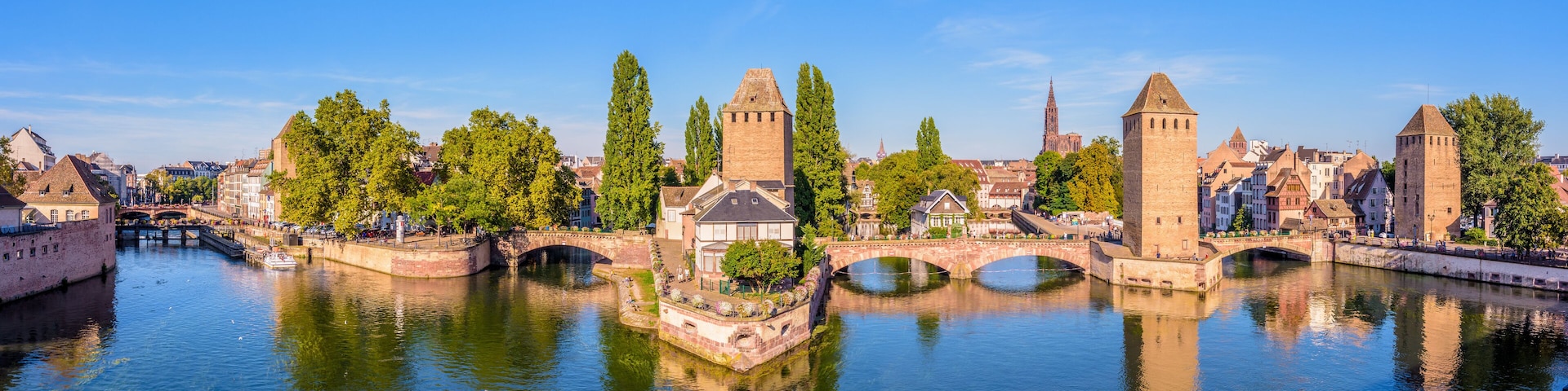 Panoramic view of the Ponts Couverts (covered bridges), a medieval set of bridges and defensive towers on the river Ill at the entrance of the Petite France historic quarter in Strasbourg, France.