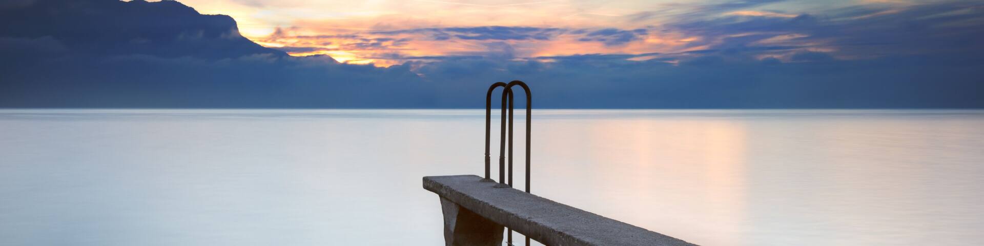 Stone pontoon at sunset, Lake Geneva, Haute-Savoie, France