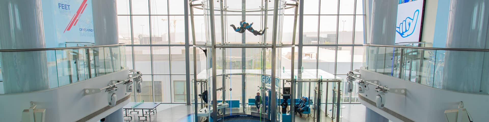 Zallaq featuring interior views and skydiving