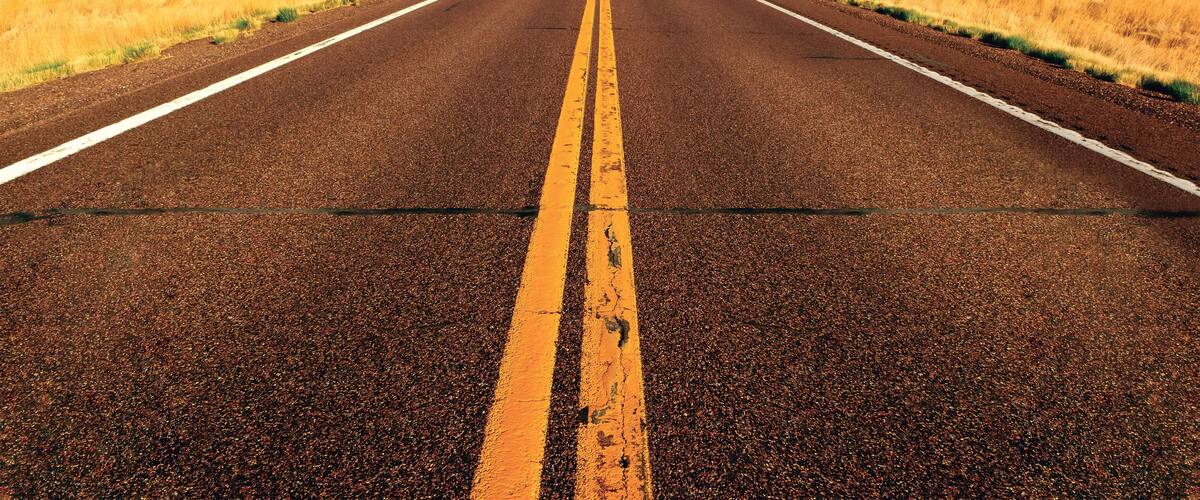Straight Road through rural landscape between Springerville and Show Low, Apache County, Arizona, USA