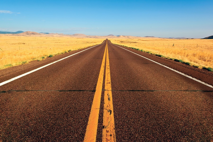 Straight Road through rural landscape between Springerville and Show Low, Apache County, Arizona, USA