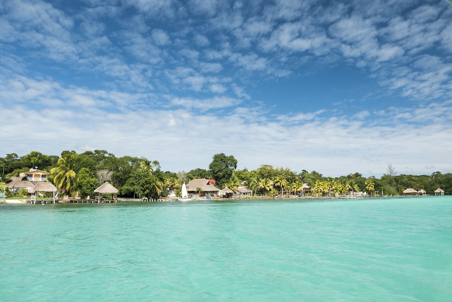 Beautiful view of caribbean lagoon Bacalar. Seven Color water; Shutterstock ID 384674023