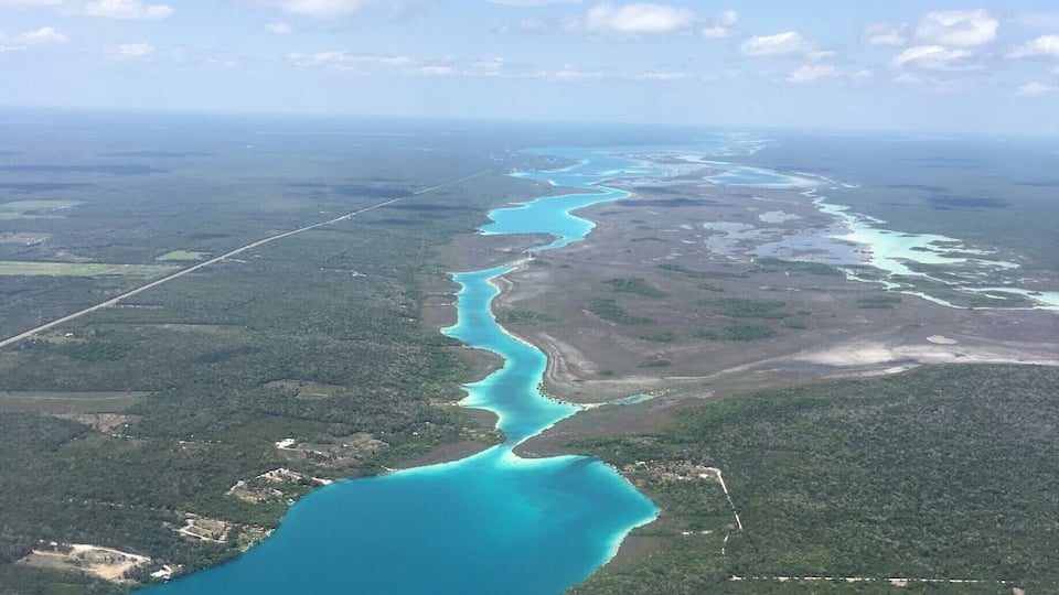 The most beautiful summer paradise hidden away in Mexico. Bacalar Lagoon has 7 different types of blue because of the overflowed cenotes. I recommend staying at Akal Ki Hotel and staying for about 3-4 days to make the most of it. #LifeAtExpedia