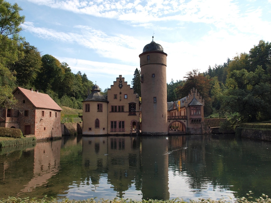 The last of the castles on our recent tour of Germany, but by no means the least.
What a stunning setting for a castle!  Well worth a visit (the hotel right next door is very charming too!)
Wikipedia describes it as follows:
Mespelbrunn Castle is a late-medieval/early-Renaissance moated castle on the territory of the town of Mespelbrunn, between Frankfurt and Würzburg, built in a tributary valley of the Elsava valley, within the Spessart forest. It is a popular tourist attraction and has become a famous Spessart landmark.
#instone
