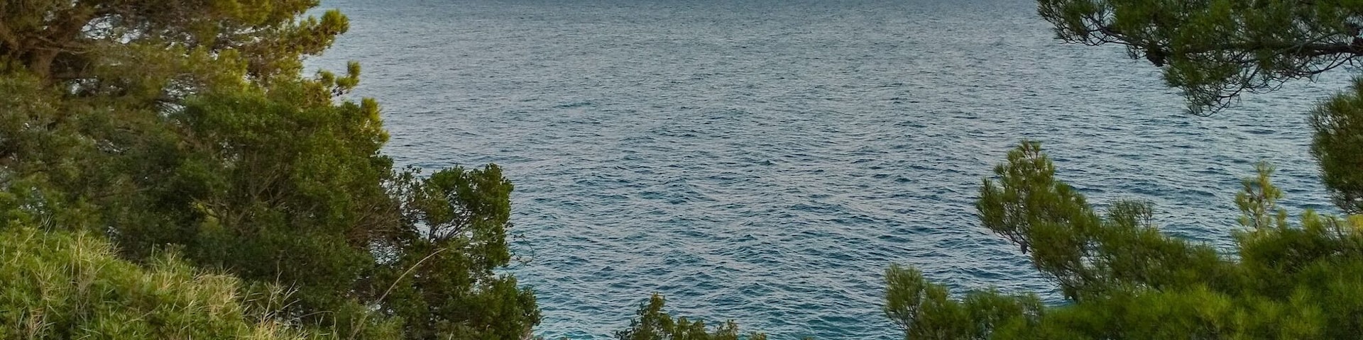 Quiet part of beachside, beaches squeezed between forests and sea