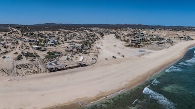 panoramic aerial landscape view of shoreline near La Fortuna, San José del Cabo, B.C.S. located on Baja California Sur, Mexico, with houses, buildings as well as wide white beach and rural landscape