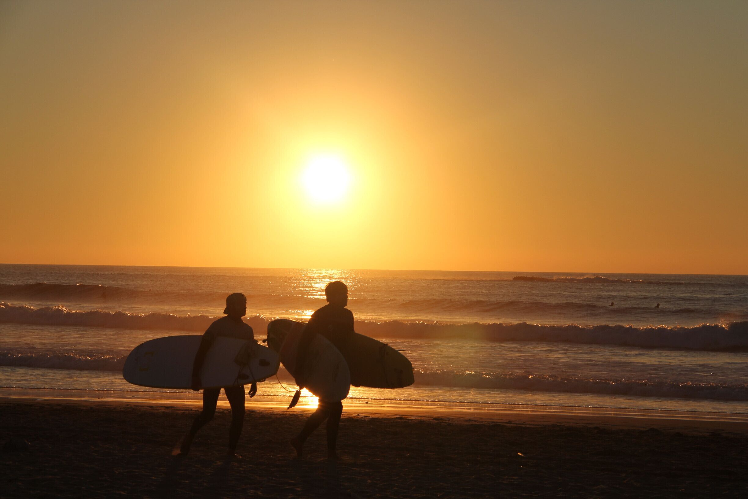 After yoga, swimming and a hike along the coast, we watched the surfers start to come in from the beach to the awesome little shack for a drink. These two heard my camera clicking and shouted in a playful way "That's 5 euros!" We all laughed. I'd gladly offer them a fiver for their role in this picture, it's one of my favourites.
 #BeachBound