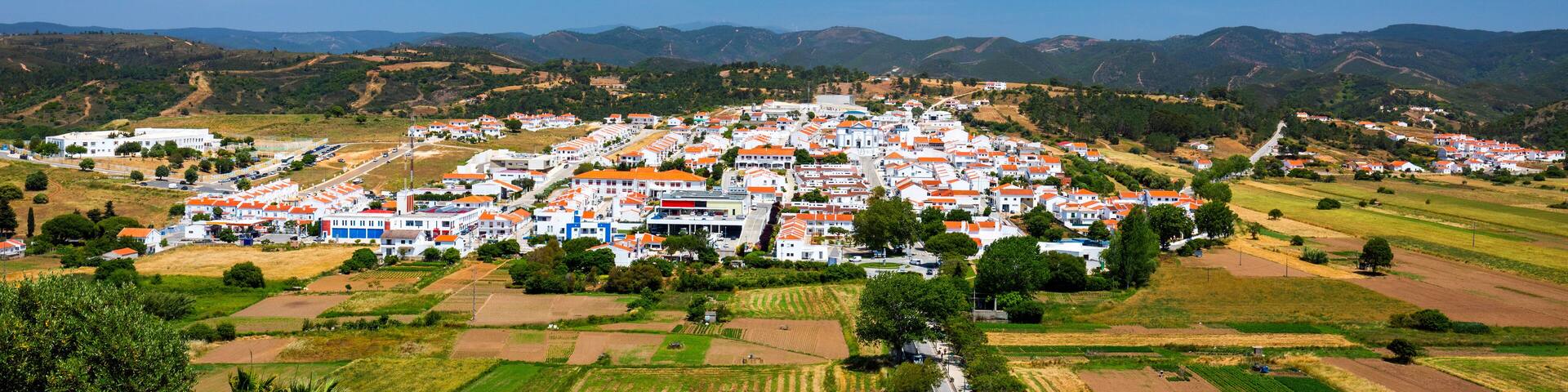Charming architecture of hilly Aljezur, Algarve, Portugal. View to the small town of Aljezur with traditional portuguese houses and rural landscape, Algarve, Portugal.