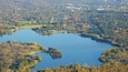 Acton featuring forests and a lake or waterhole