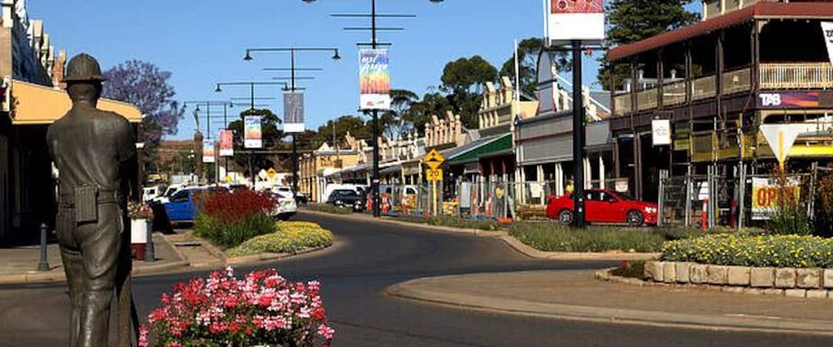 Burt Street, Boulder.
Boulder is now a part of Kalgoorlie. At the time of the 20th century Kalgoorlie and Boulder were rivals. Each had is own main street and town hall,
Boulder was home to mine workers and their families.
The front shop facades are currently being restored.