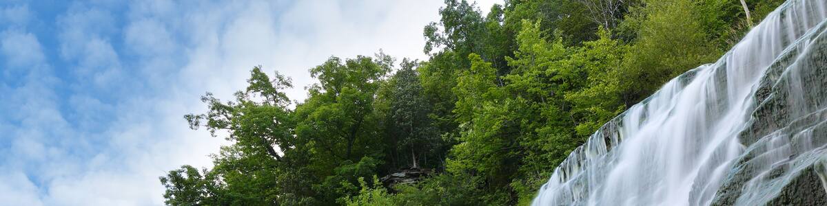 Hector Falls on a sunny morning. The waterfalls is located near Watkins Glen State Park in upstate of New York Finger Lakes region.