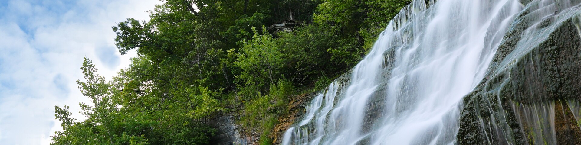 Hector Falls on a sunny morning. The waterfalls is located near Watkins Glen State Park in upstate of New York Finger Lakes region.