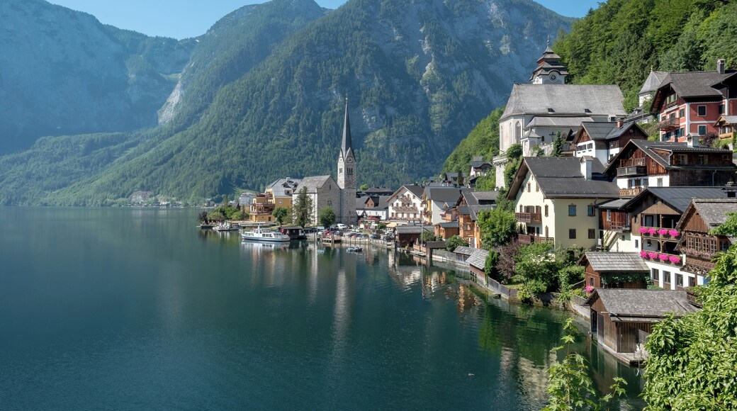 A picturesque Austrian village nestling by Lake Hallstatt, Hallstatt is arguably one of the most beautiful places in the world. Referred to as "the pearl of Austria", Hallstatt is famous for both the beauty of its architecture and the enchanting scenery that surrounds it. The traditional salt mining village dates back 800 years before Christ, and the salt mines that made its fame and fortune are the world's oldest. The village features houses that are built into the mountain rock, and it sits by a lake whose waters mirror the sky.