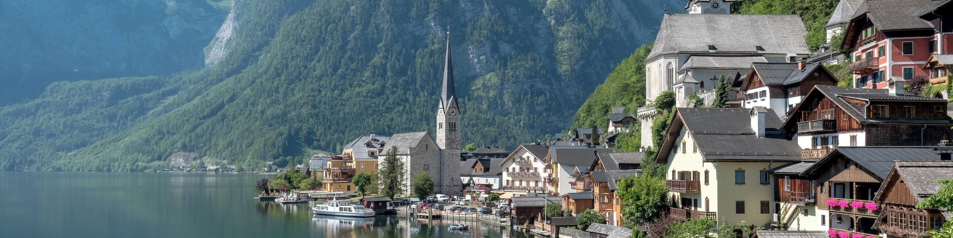 A picturesque Austrian village nestling by Lake Hallstatt, Hallstatt is arguably one of the most beautiful places in the world. Referred to as "the pearl of Austria", Hallstatt is famous for both the beauty of its architecture and the enchanting scenery that surrounds it. The traditional salt mining village dates back 800 years before Christ, and the salt mines that made its fame and fortune are the world's oldest. The village features houses that are built into the mountain rock, and it sits by a lake whose waters mirror the sky.