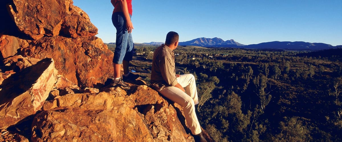 West MacDonnell National Park featuring a sunset, hiking or walking and landscape views