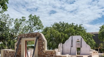 Darwin Australia - February 22, 2019: Town Hall Ruins downtown now set in green park under blue sky with white clouds. Couple of standing walls are left.