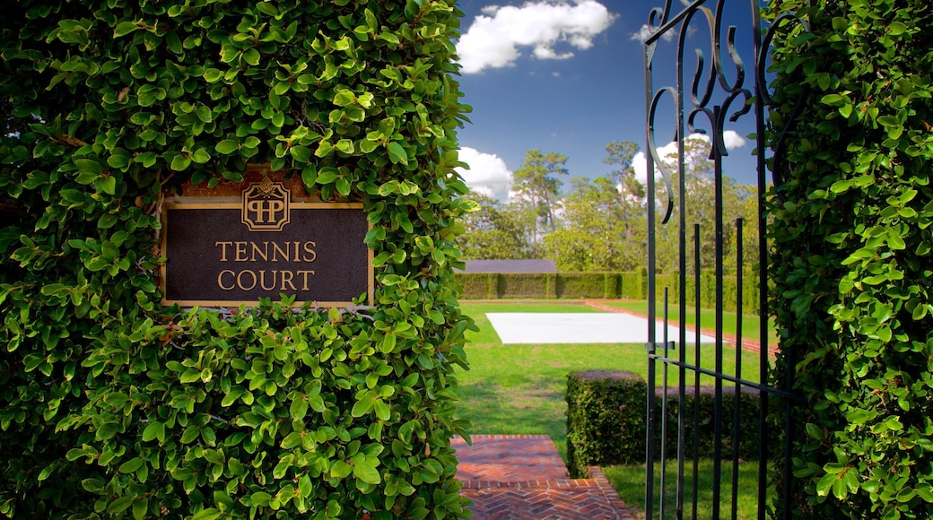 Pebble Hill Plantation featuring a garden and signage