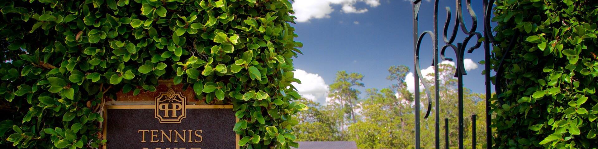 Pebble Hill Plantation featuring a garden and signage