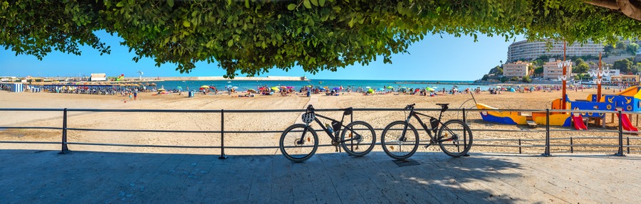 Panorama with sunny sand beach and waterfront at Peniscola. Castellon, Spain
