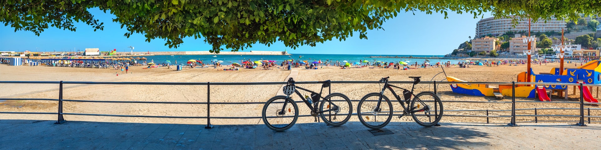 Panorama with sunny sand beach and waterfront at Peniscola. Castellon, Spain