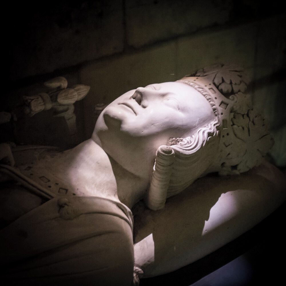 Statues and monuments in the underground vaults of the Chateau