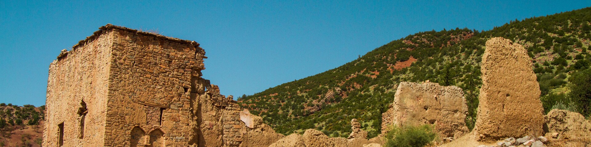 ruin of a kasbah against sky in a sunny day - bine el ouidane - morocco