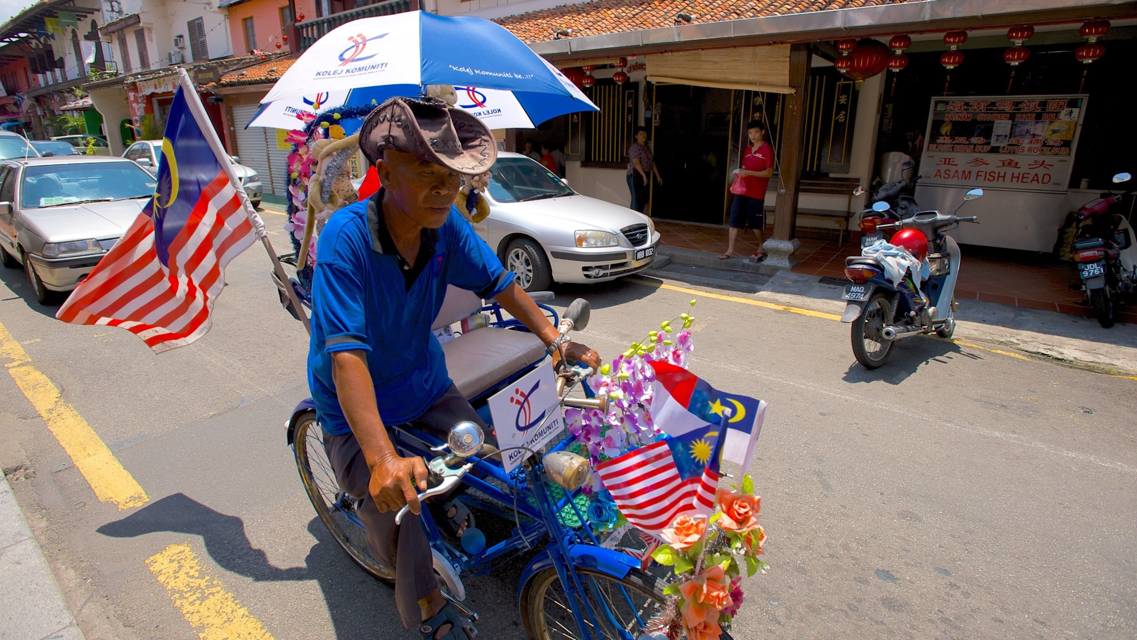 Malacca showing street scenes and cycling as well as an individual male