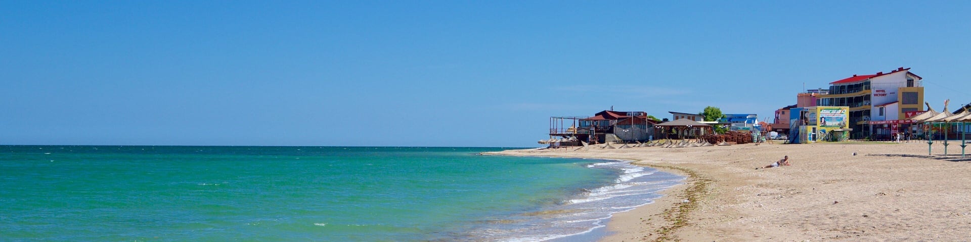 Vama Veche which includes a sandy beach and general coastal views