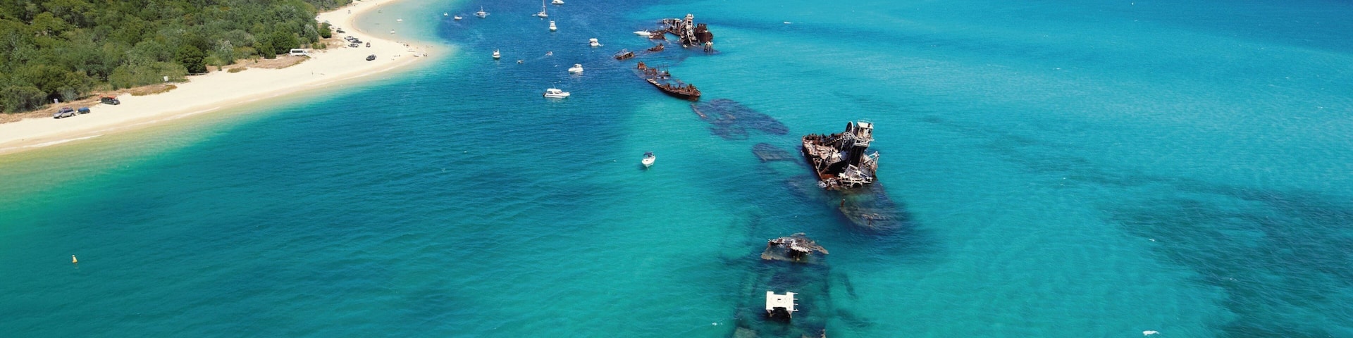 Tangalooma welches beinhaltet allgemeine KĂŒstenansicht, Strand und tropische Szenerien