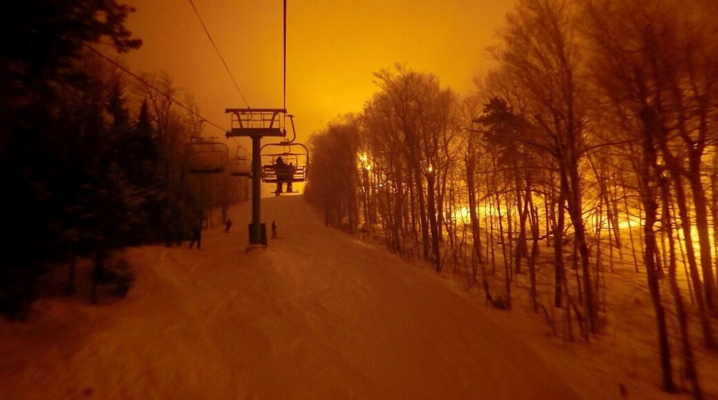 Some of the best night skiing in the eastern part of the U.S. Lights radiate off of low hanging moisture rich clouds.
