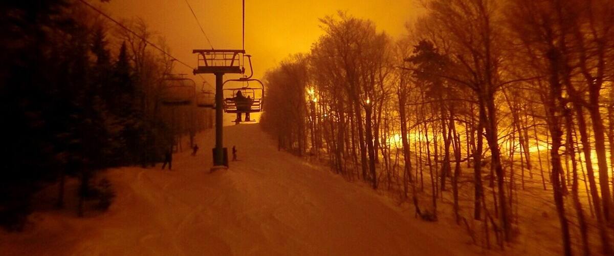 Some of the best night skiing in the eastern part of the U.S.  Lights radiate off of low hanging moisture rich clouds.