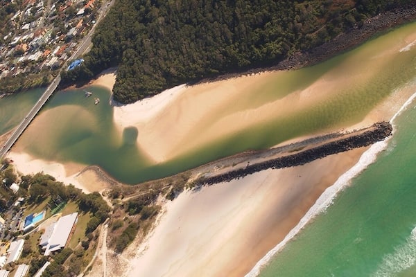 shoreline of GOLD COAST showing a foot path extending thru the Beach