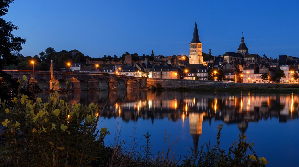 La Charité sur Loire, a typical french village in Burgundy (FRANCE) reflecting on the river Loire at the blue hour.