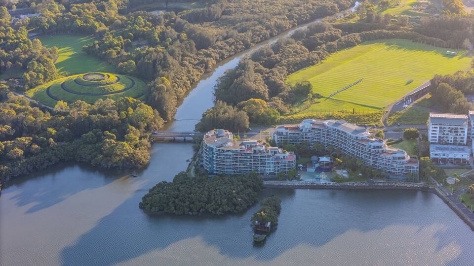 Aerial view above Rhodes with views to Wentworth Point and Concord West with Parramatta River in Sydney NSW Australia