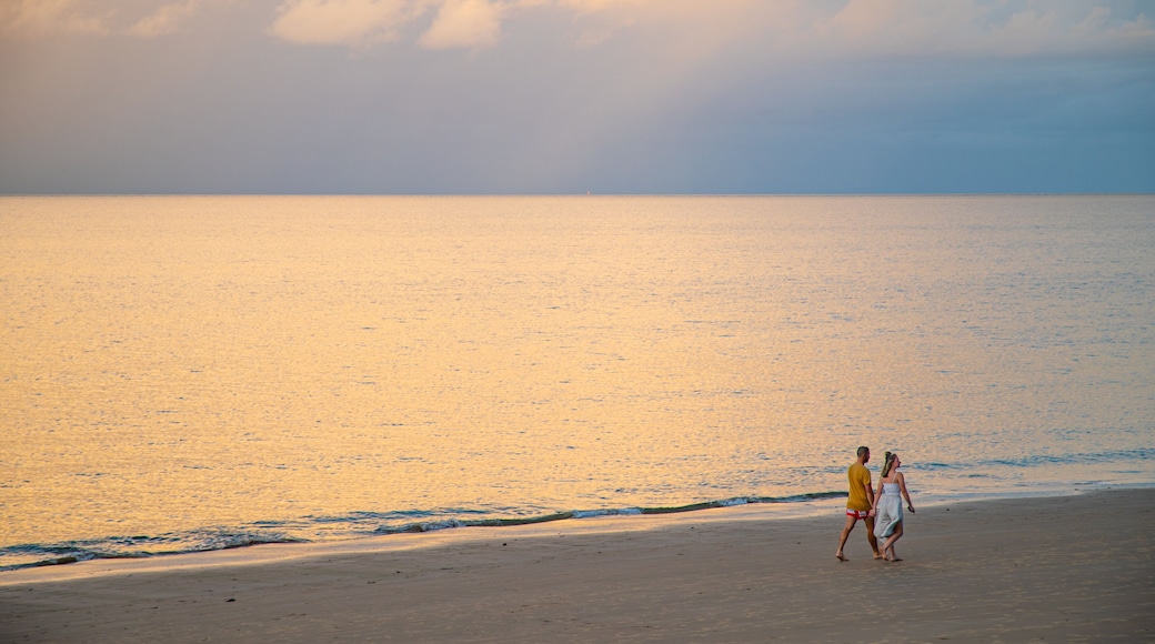 Torquay showing a beach, a sunset and general coastal views