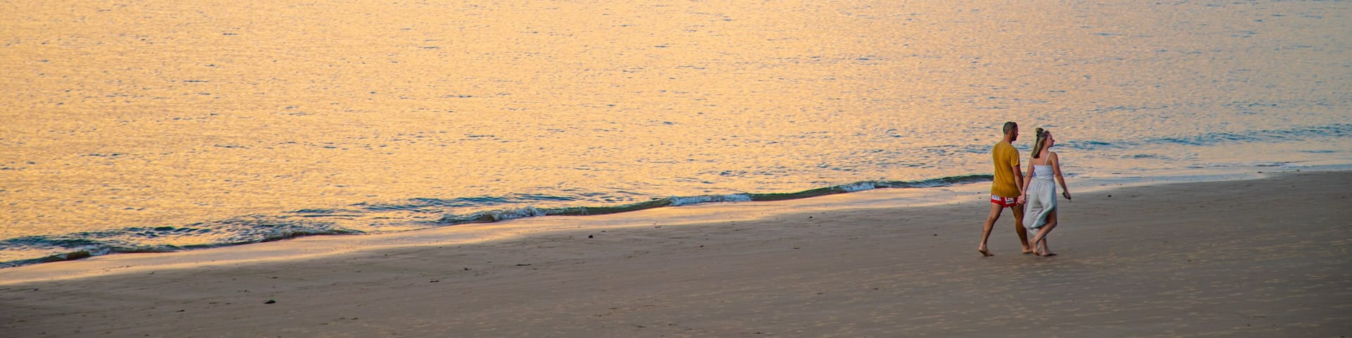Torquay showing a beach, a sunset and general coastal views