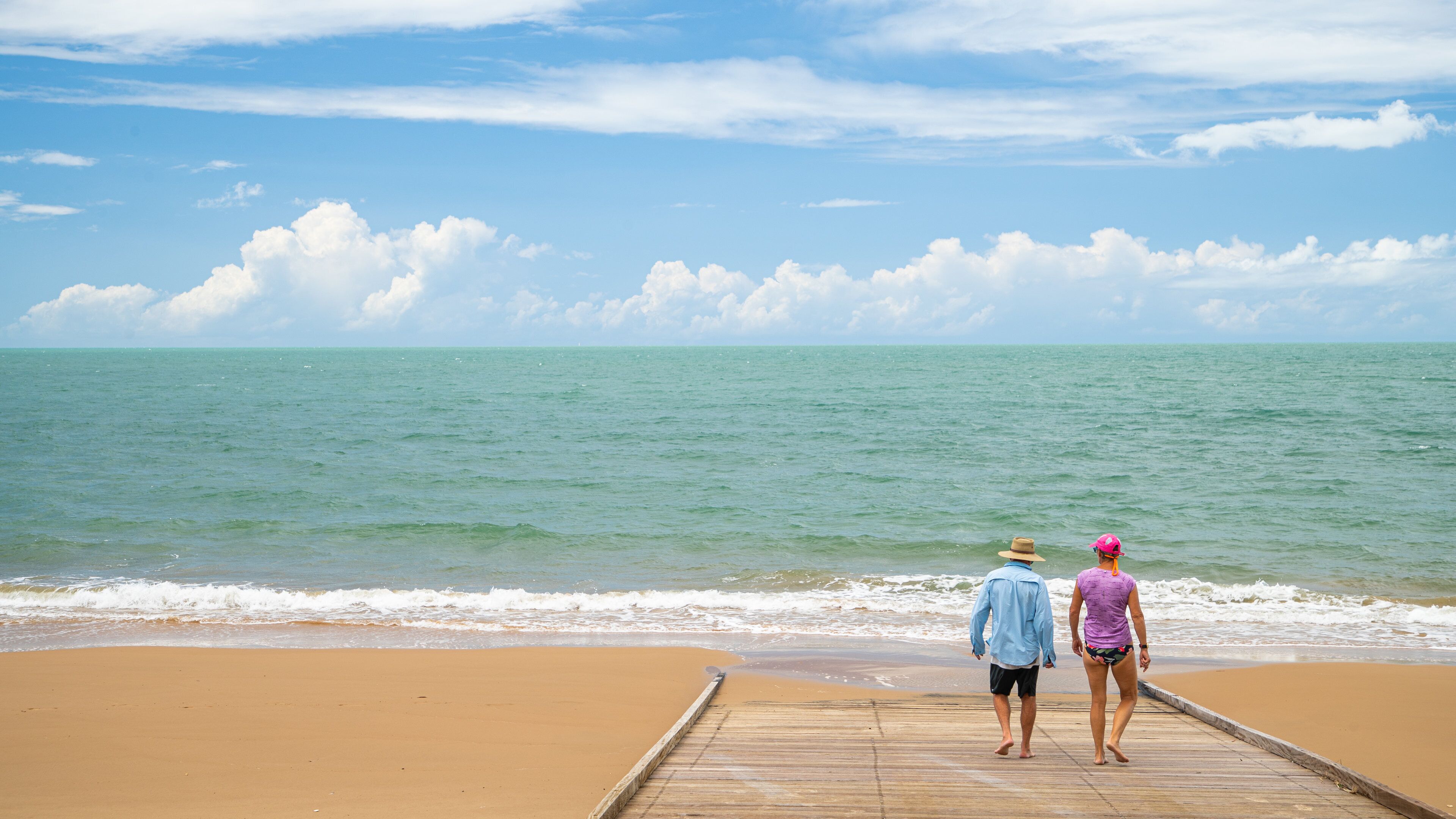 Scarness showing a sandy beach and general coastal views as well as a couple