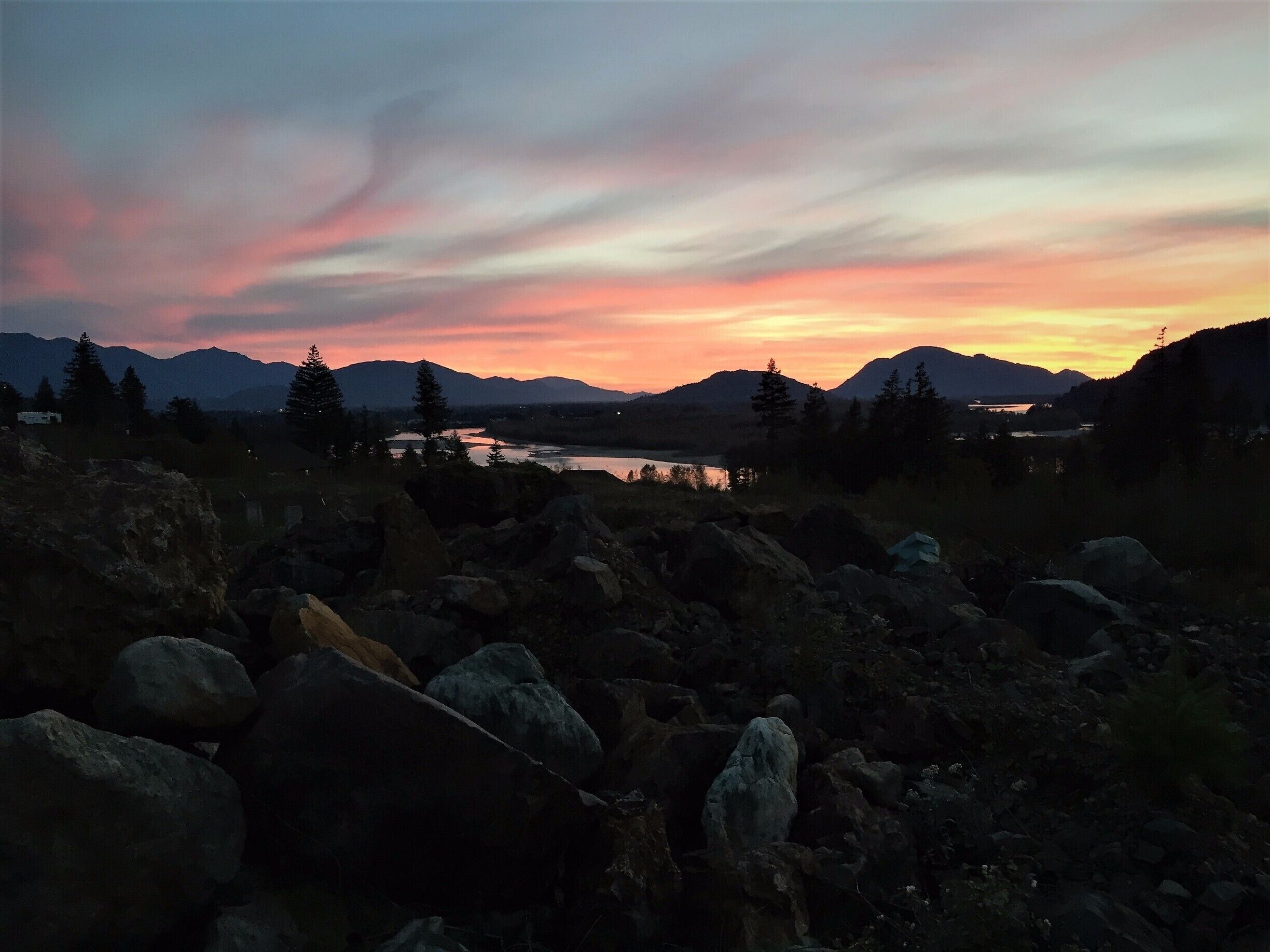 The stream of pinkish clouds over the mountains with the Fraser River below made for an amazing sunset.