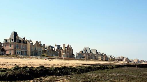 The Normandy beach with some old houses .