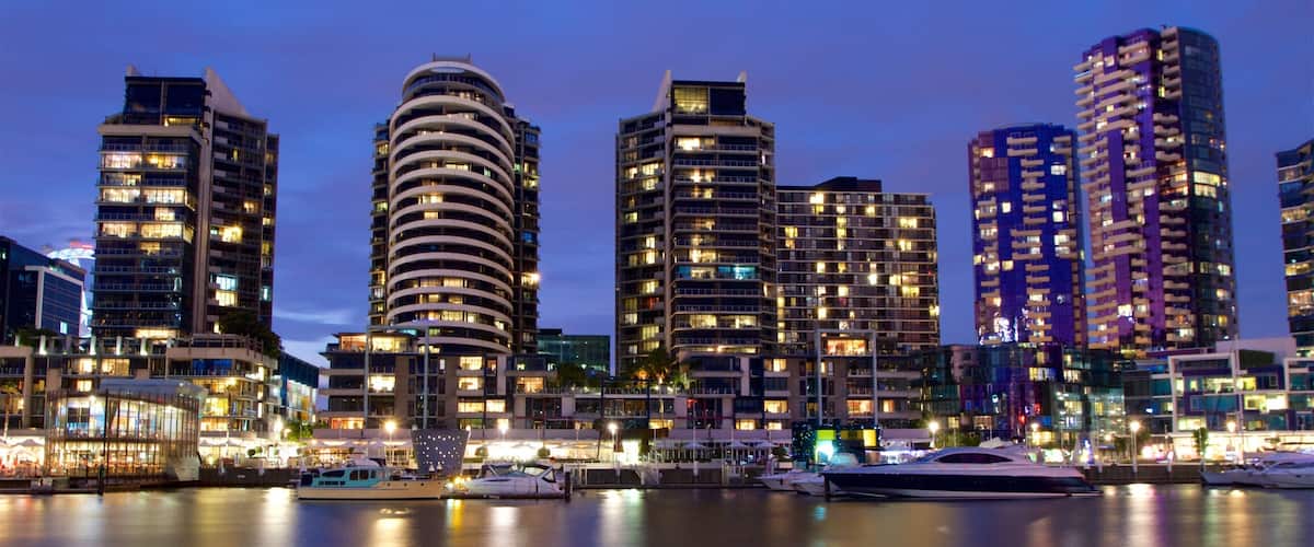 Docklands featuring a bay or harbor, night scenes and a skyscraper