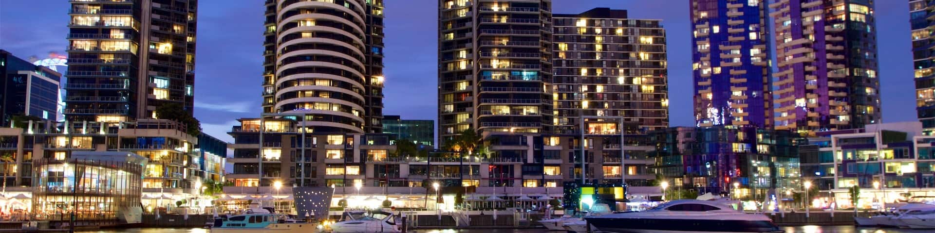 Docklands featuring a bay or harbor, night scenes and a skyscraper