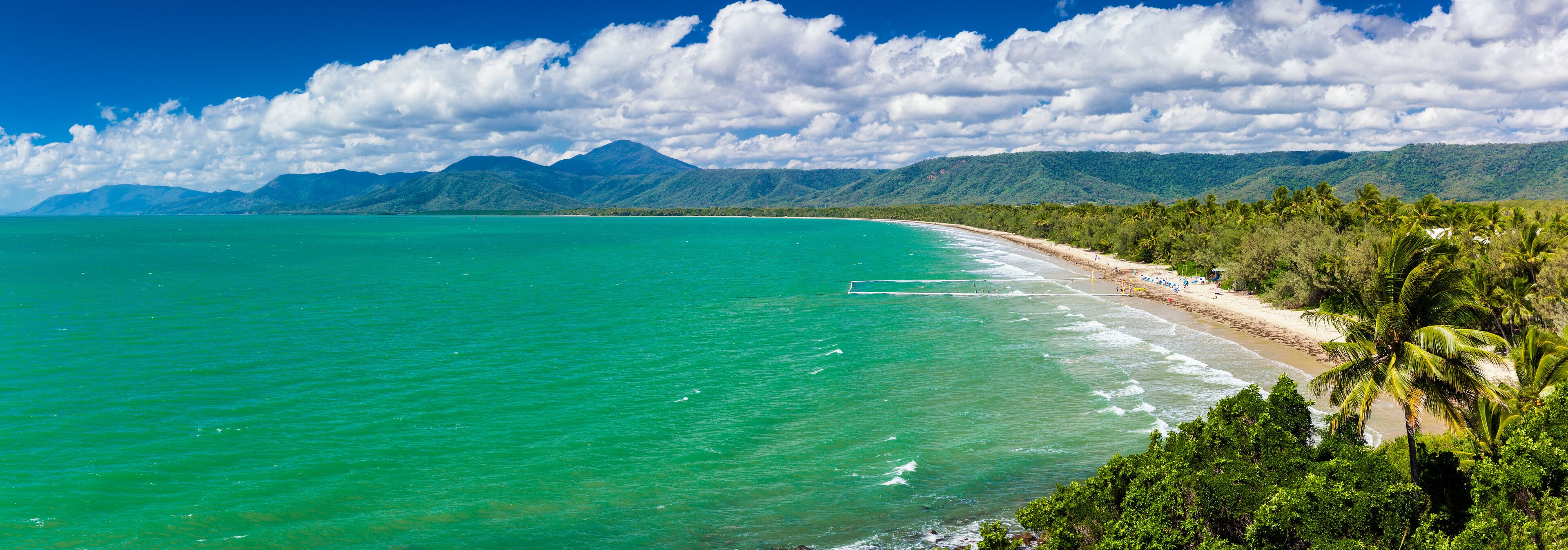 Port Douglas four mile beach and ocean on sunny day, Australia