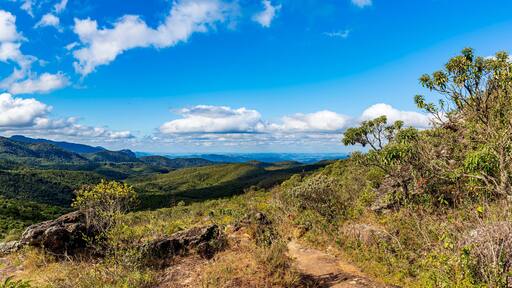 Panoramic image of the mountain ranges with their rocks and vegetation and typical forests of the state of Minas Gerais in Brazil on a sunny day