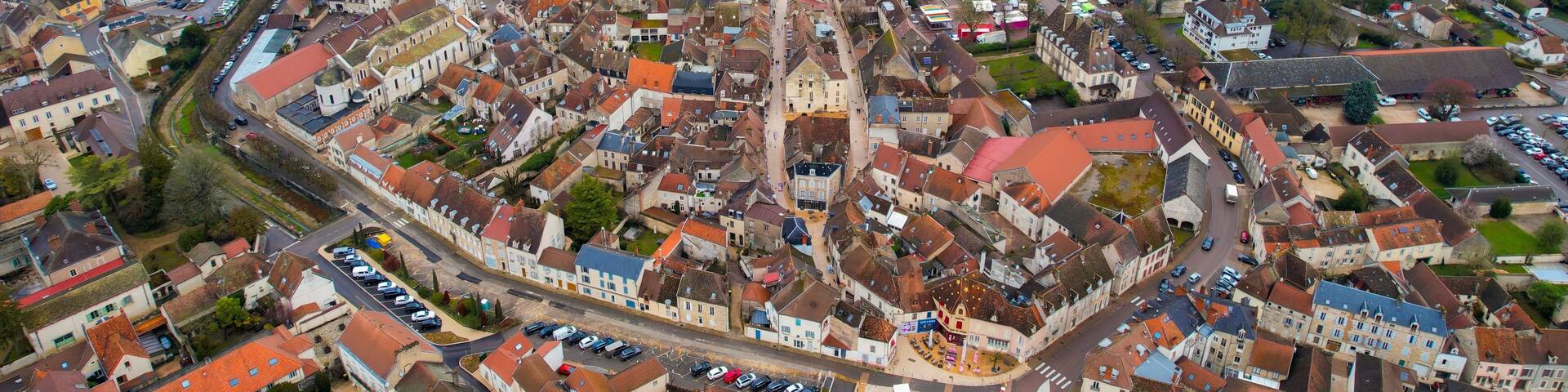 Aerial of the old town of Nuits-Saint-Georges in France on a cloudy morning in early spring.