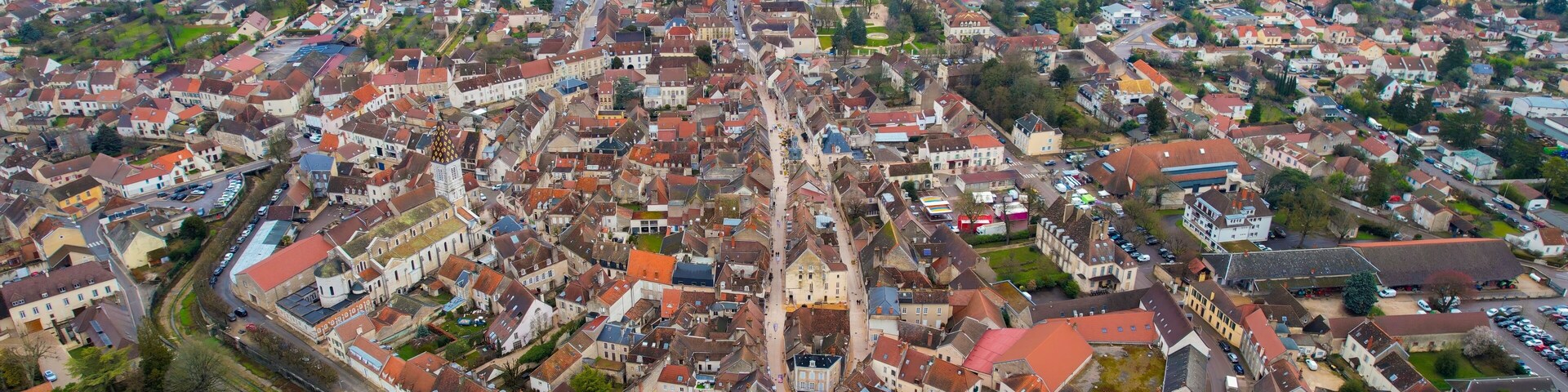 Aerial of the old town of Nuits-Saint-Georges in France on a cloudy morning in early spring.